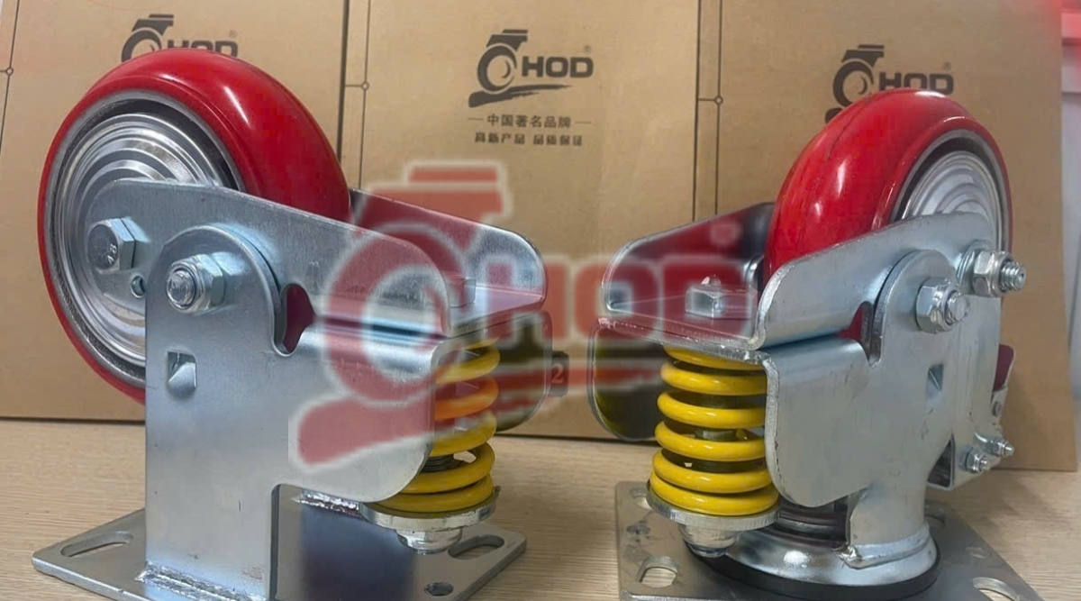 Bánh xe đẩy kéo hàng có lò xo giảm xóc cho nhà xưởng
